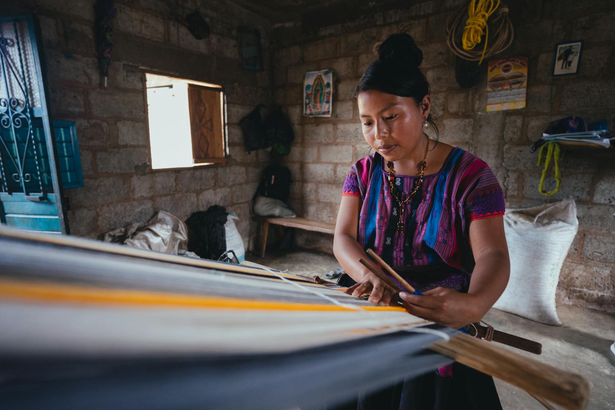 A master weaver at the loom